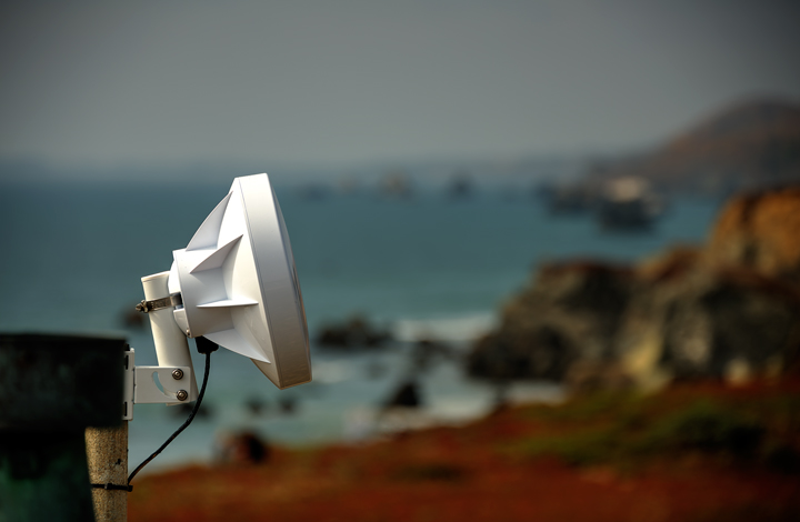 Radio equipment with rocky coast in background